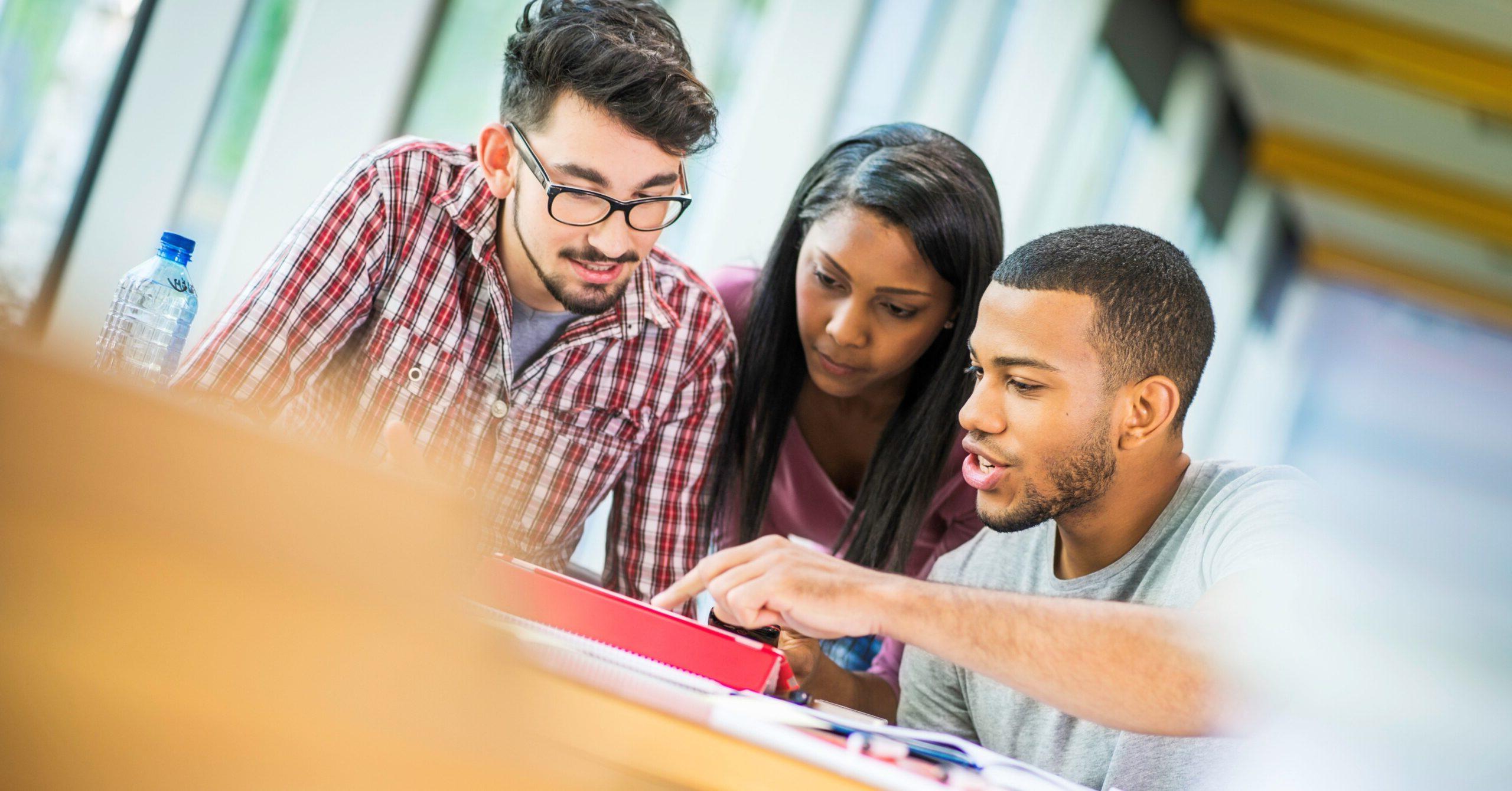 Students looking at a computer